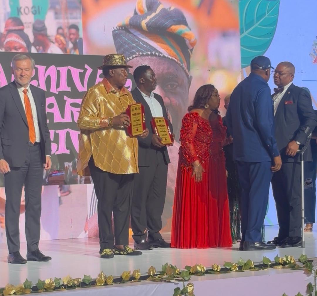 Senator Florence Ita-Giwa receiving recognition on stage