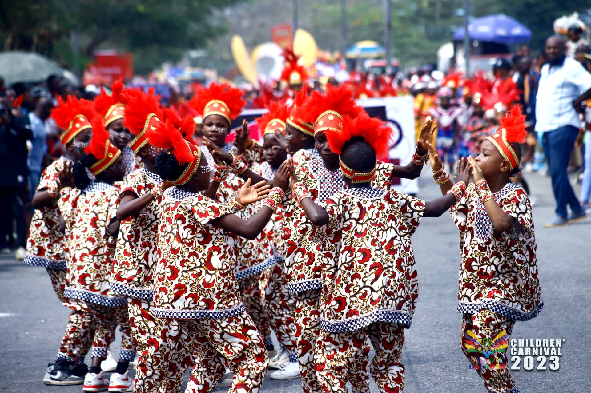 Children dancing in matching printed costumes